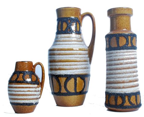 A group of three vintage retro mid 20th century West German ceramic vases of graduating form in a matching design. Measures 3