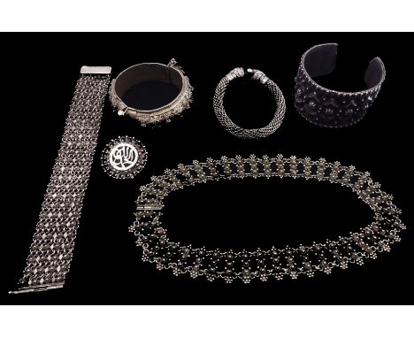 Collection of Indian silver including bangle with snake clasp, hinged bangle, torque bangle, bracelet, necklace and broochCon