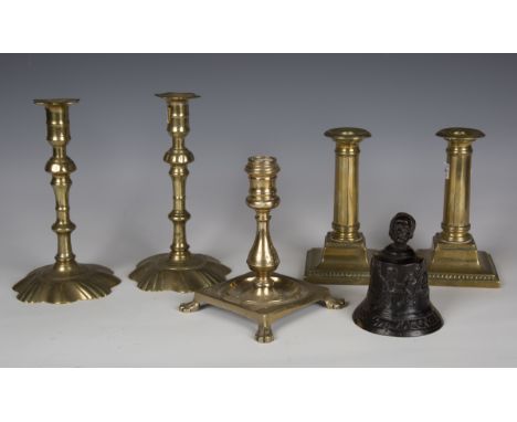 A pair of George III brass candlesticks, height 20cm, together with another pair of George III brass candlesticks, a single c