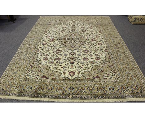 A Kashan carpet, Central Persia, mid/late 20th century, the ivory field with a lobed floral medallion, 350cm x 253cm.Buyer’s 