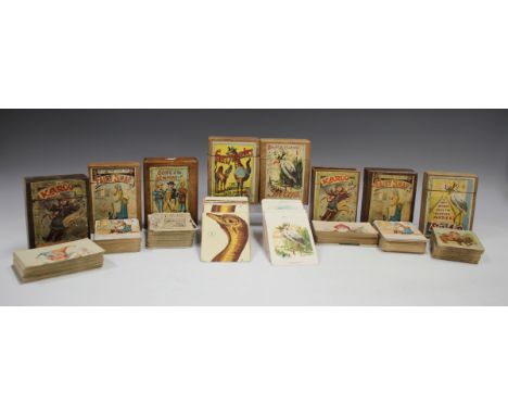 A group of eight wooden cased playing card games, including 'Sons of the Empire', 'Fairy Snap', 'Karoo', 'Gerrymanders' and '