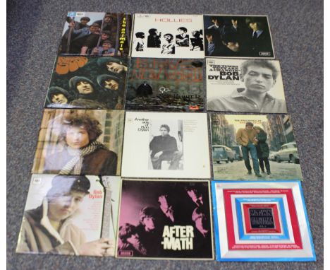 A collection of 1960s and 1970s LP records, including 'No 2' and 'Aftermath' by The Rolling Stones, 'Rubber Soul' by The Beat