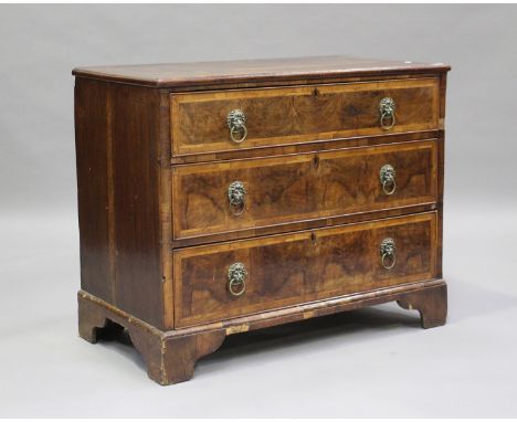 An 18th century oak and walnut chest of three drawers with crossbanded borders, on bracket feet, height 83cm, width 103cm, de