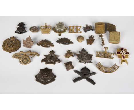A small collection of early 20th century military cap badges and other titles, including Army Cyclist Corps, Canadian 145th O