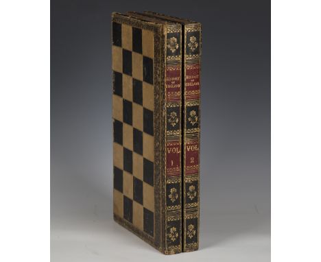 A late Victorian leather bound folding chess and backgammon board, width 43cm, and four playing card sets.Buyer’s Premium 29.