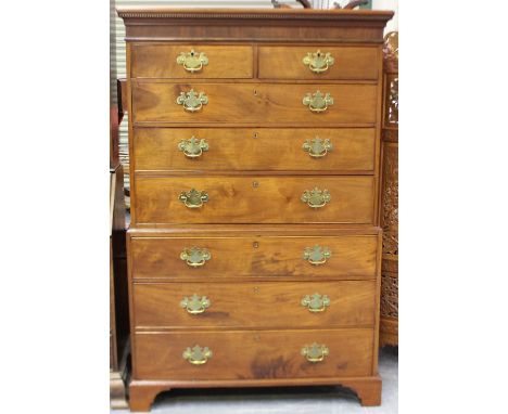 A George III figured mahogany chest-on-chest, fitted with two short and six long drawers, on bracket feet, height 181cm, widt