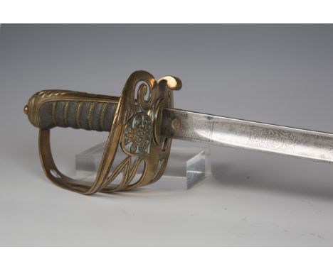 A Victorian 1892 pattern infantry officer's sword with dumbbell-section blade, blade length 83cm, brass gothic hilt and wire-