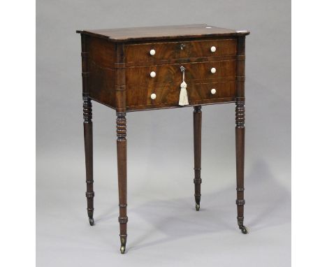 A George IV figured mahogany side table with projecting corners, the two drawers with bone handles and key escutcheons, on tu