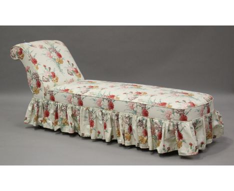 A late Victorian daybed, upholstered in a printed floral fabric with a cream ground, on turned baluster legs and castors, hei