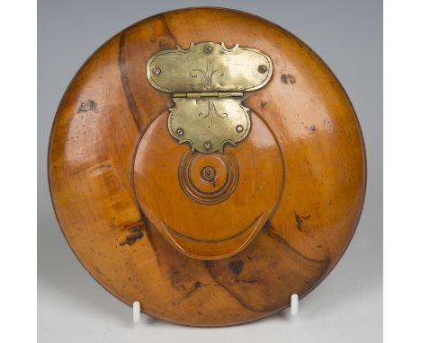 An early 19th century Continental fruitwood circular table snuff box with brass hinged lid, diameter 17cm.Buyer’s Premium 29.