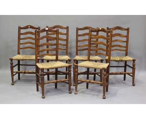 A set of six early 19th century provincial fruitwood ladder back kitchen chairs, height 95cm, width 50cm, depth 39cm (some fa