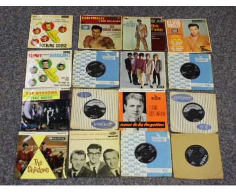 A collection of 7-inch records, comprising singles and EPs, including releases by Eddie Cochran, Buddy Holly, Elvis Presley, 