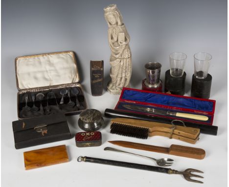 A small group of collectors' items, including a cast composition figure of a religious icon, two late Victorian cased glass m