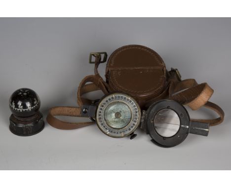 A Second World War period military compass, Mk III, dated 1942, with leather case, together with a small marine compass.Buyer