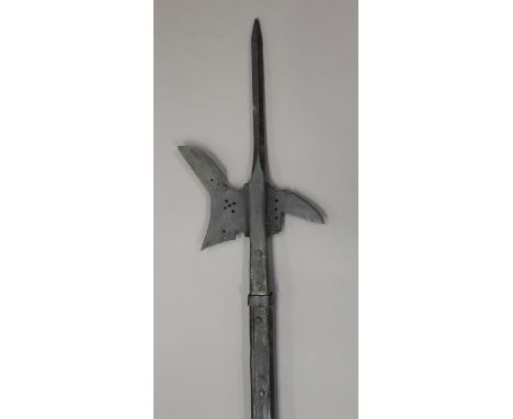 A 16th century style North German halberd with central spike, crescentic axe-blade and downturned rear-fluke, held within a l