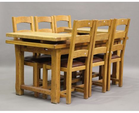 A modern oak refectory table with two extra end leaves, height 75cm, extended length 182cm, depth 84cm, together with six mat