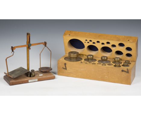 A collection of boxed mid-20th century graduated scientific weights, together with two sets of technical drawing instruments 