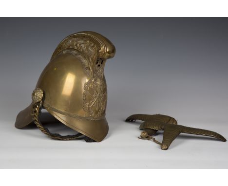 A late 19th/early 20th century brass Merryweather type fireman's helmet with dragon decorated comb cresting, applied badge wi