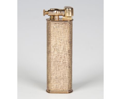 A silver gilt gold cased Dunhill lighter with engine turned decoration, boxed.Buyer’s Premium 29.4% (including VAT @ 20%) of 