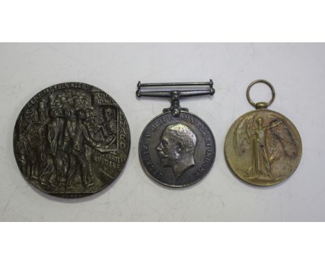 A 1914-18 British War Medal and a 1914-19 Victory Medal to 'G 47068 Pte.W.Stone. Midd'x R.' and a cast iron copy of a sinking