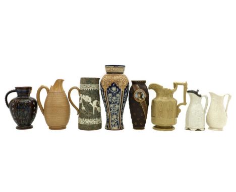 A group of Doulton stoneware items,comprising a Lambeth jug, 22.5cm high, a Slater's Patent tapering jug, relief moulded with