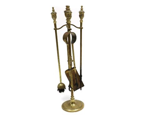 A set of brass fire tools and stand,19th century,stand 67cm high (5)Condition ReportGeneral wear and tarnish commensurate wit