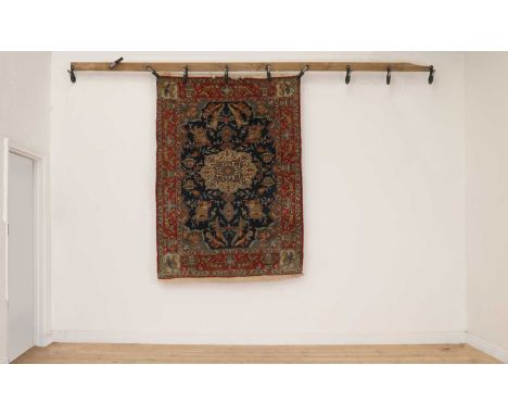 A Persian wool and silk rug,first half of the 20th century, Kashan, the field woven with floral, animal and mythical beast mo