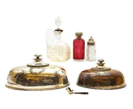 A group of silver mounted cut glass bottles,comprising a cranberry glass bottle, marked 925, 17cm high, a sifter, Sheffield 1
