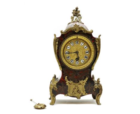 A French Boulle work mantel clock,19th century, of shaped outline, the gilt metal dial with enamelled Roman numeral markers, 