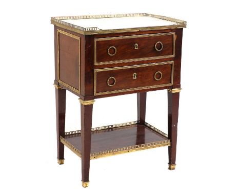 A Louis XVI style mahogany and gilt metal mounted commode,19th century, the top with white marble inset within a three-quarte