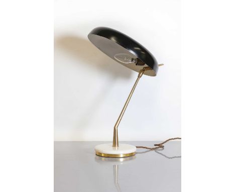 An Italian brass and marble desk lamp,1950s, with a black-enamelled circular dish shade, with a single bulb, raised on a circ