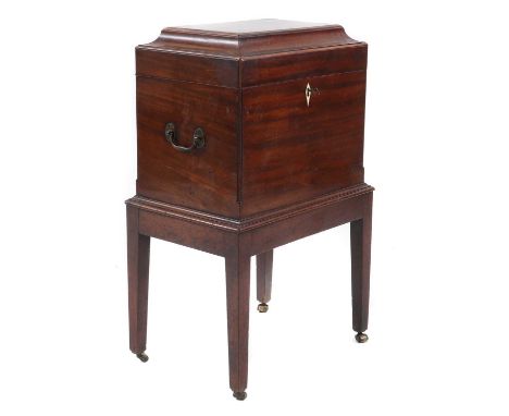 A George III mahogany cellarette and stand,with an ivory escutcheon, on tapering supports, raised on brass castors,39cm wide2