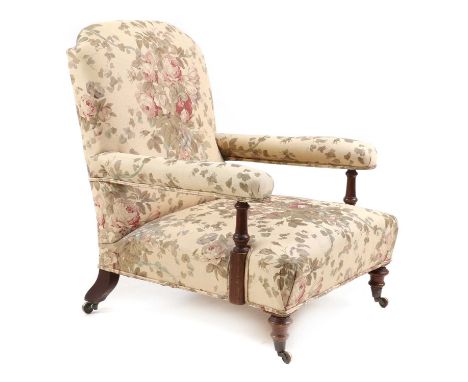A Victorian walnut open armchair,mid-late 19th century, upholstered in Bennison 'Roses' fabric, raised on turned supports ter