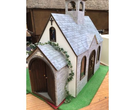 Dolls House/Church: a quality dolls House in the form of a Church. furnished and includes people and lighting. Width 55cm, de