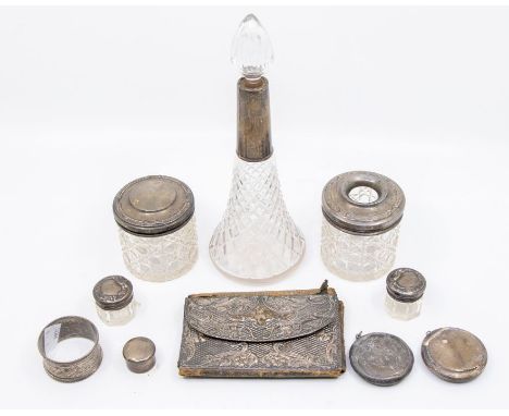 A collection of mainly early 20th Century silver to include: silver mounted cut glass toilet bottles and scent bottle, two ci