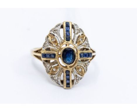 A sapphire and diamond 9ct gold ring, comprising an oval shape set to the centre with an oval rub over set sapphire, with wit