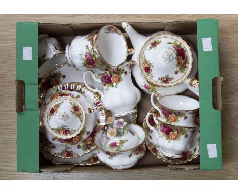 A Royal Albert Old Country Roses comprising five cups, five saucers, six side plates, teapot, milk jug, sucrier, cake plate, 