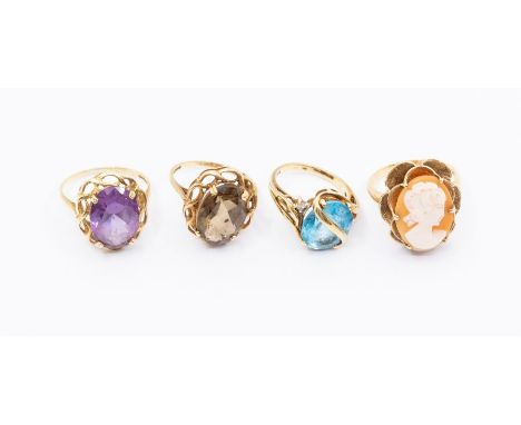 A collection of 9ct gold stone set vintage dress rings, to include a blue topaz and diamond ring, size I1/2, a smoky quartz r