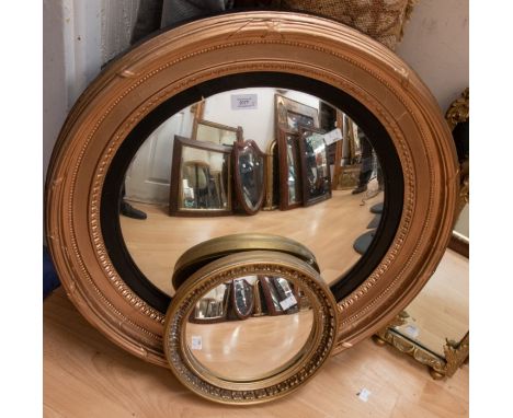 A Regency style gilt circular butlers/convex mirror (restored) together with a smaller mirror, 19th Century