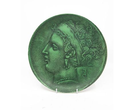 Fornasetti, Milano, Italy - a plate, depicting a portrait of a Roman female, green ground, approx 26cm diam