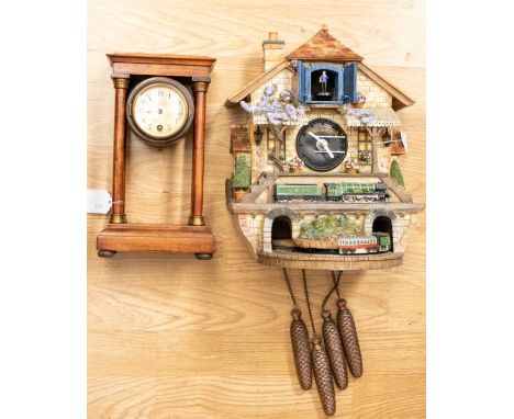 Railway interest; a novelty automaton battery operated wall clock, in the form of a station, with a miniature Flying Scotsman