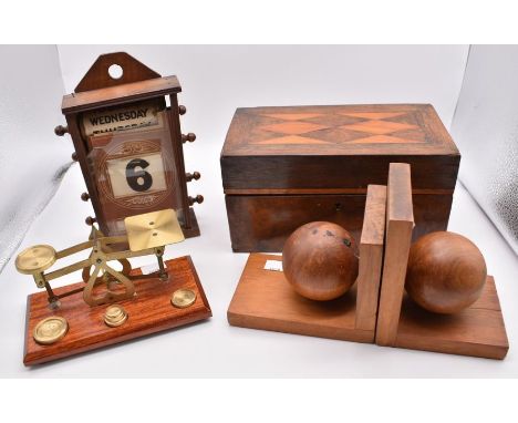 A walnut and rosewood crossbanded 19th century box / tea caddy; a 1940's oak perpetual calendar (af); a pair of oak bookends;