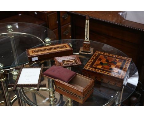 A collection of Tunbridge ware sewing related items including a parquetry inlaid sewing box, a sewing case with pin cushion t