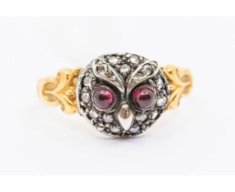 A garnet and diamond set dress ring in the Georgian style, comprising an owl form, set with cabochon garnet eyes and rose cut