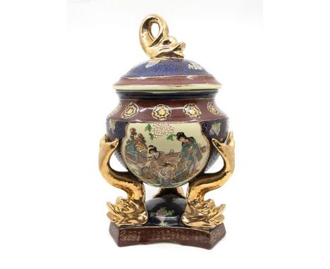 A Chinese Satsuma style tripod vase and cover, raised on dolphin supports, shaped base, approx 40cm high