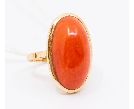 A coral and 18ct gold dress ring, comprising an elongated coral approx 20 x 11mm, in a collet setting, size N, total gross we