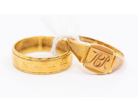 An 18ct gold signet ring, cushion top engraved with A.R, size Q along with a wedding band with star engraved pattern, width a