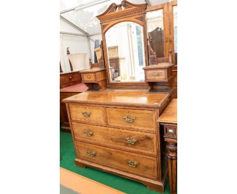 A James Shoolbred &amp; Co walnut bedroom suite, circa 1890, comprising mirror backed dressing chest, fitted with two small d