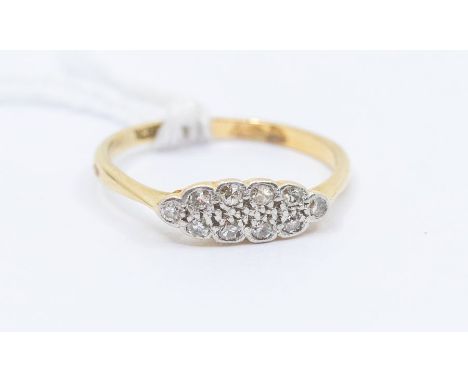 An Edwardian diamond and 18ct gold cluster ring, elongated scalloped form set with small eight cut diamonds, size M1/2, total