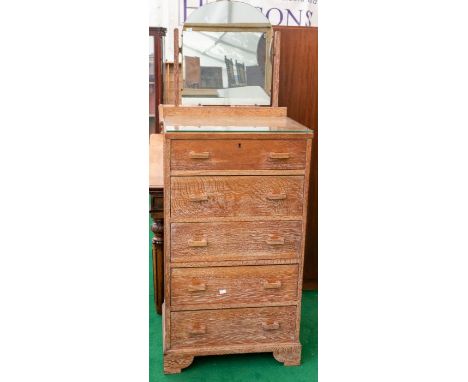 An Art Deco limed oak mirror-backed chest of drawers, fitted with five drawers, 162cm high, 60cm wide, 47cm deep